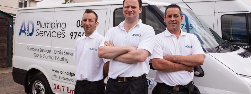 A & D Plumbing Services employees outside van